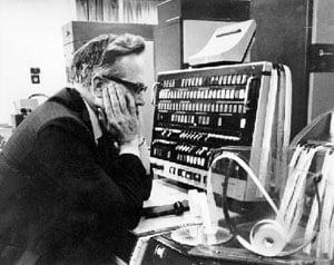 Tom Kilburn in front of Manchester Atlas computer console in 1962