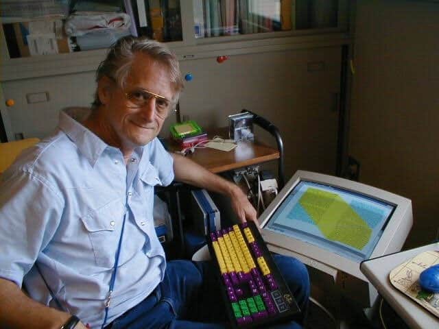 Ted Nelson sitting at his computer