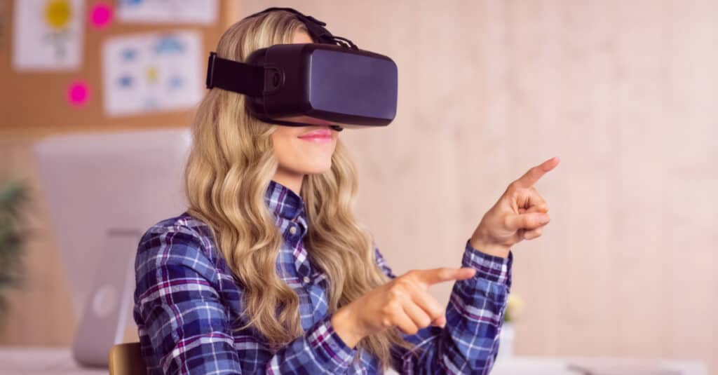 Woman with oculus virtual reality headset on.