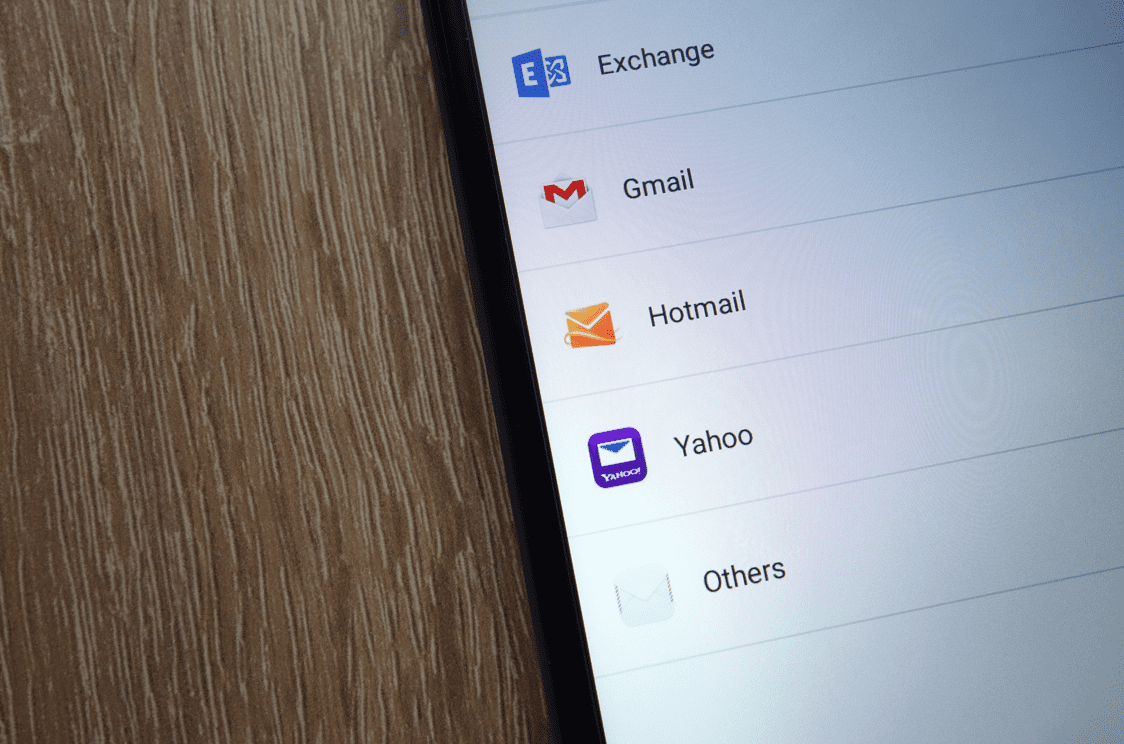 Exchange, Gmail, Hotmail, and other popular email domains listed on a smartphone screen.