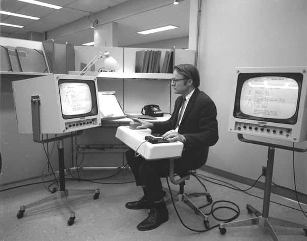 Bill English, Engelbart's lead engineer, testing the first mouse and keypad.