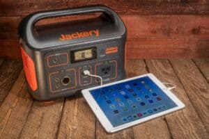 Jackery mobile power station charging an iPad.