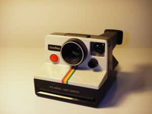polaroid onestep instant camera with a red shutter button