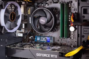AMD RYZEN 5 5600x CPU next to an Nvidia Geforce RTX Graphics Card inside a custom-built gaming rig.