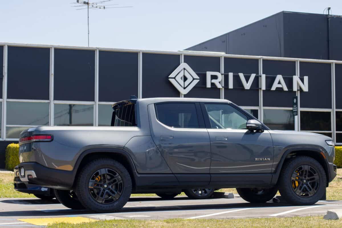 Rivian R1T truck parked outside a Rivian service center
