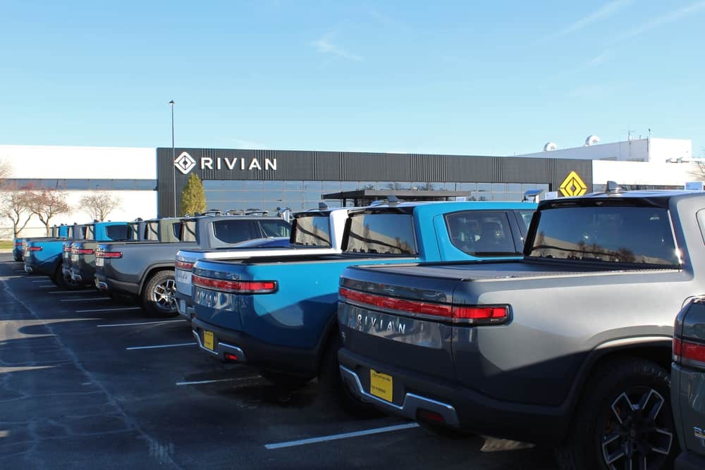 Rivian trucks parked outside the companies car factory