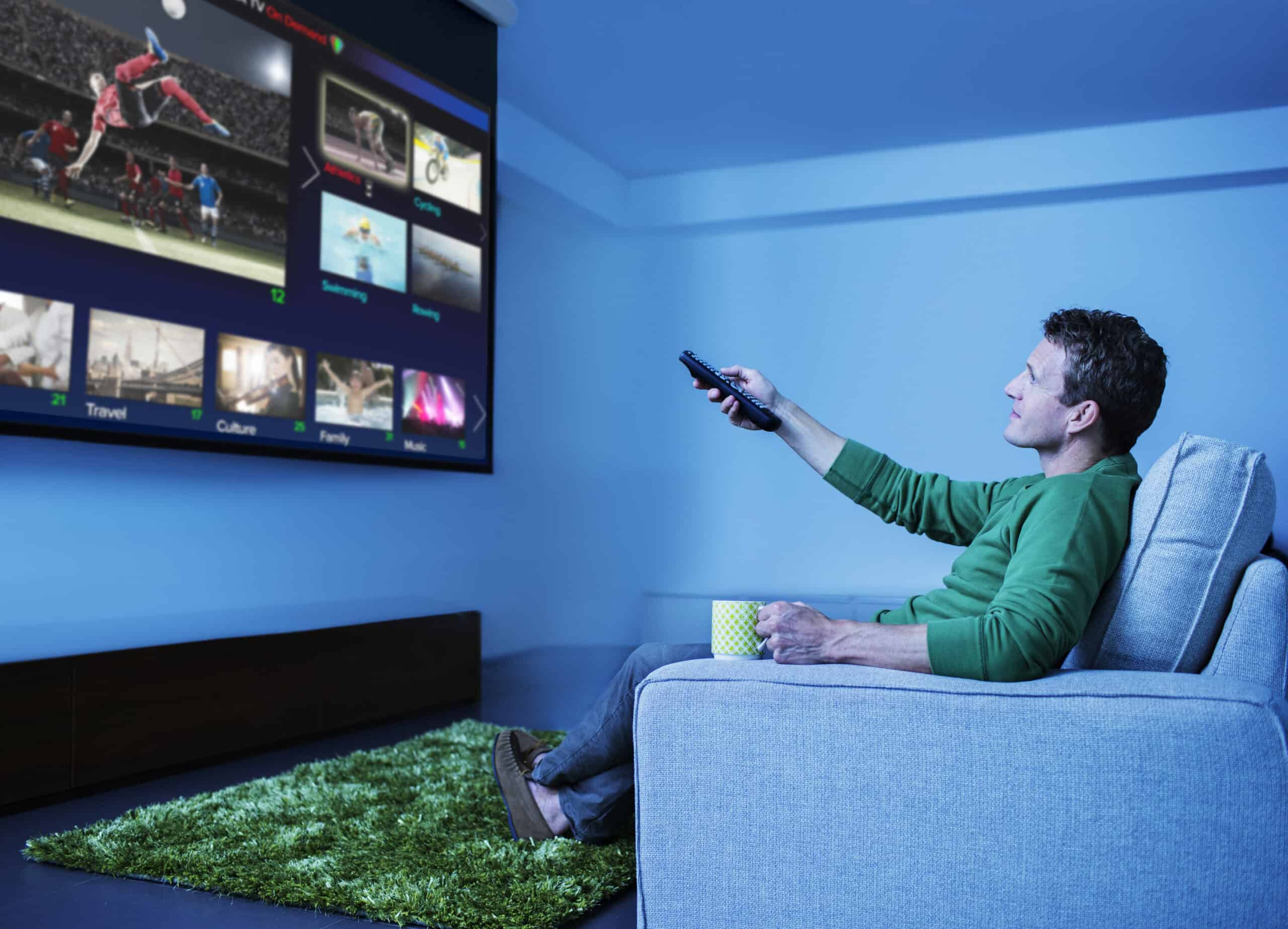 Man watching smart tv television in living room