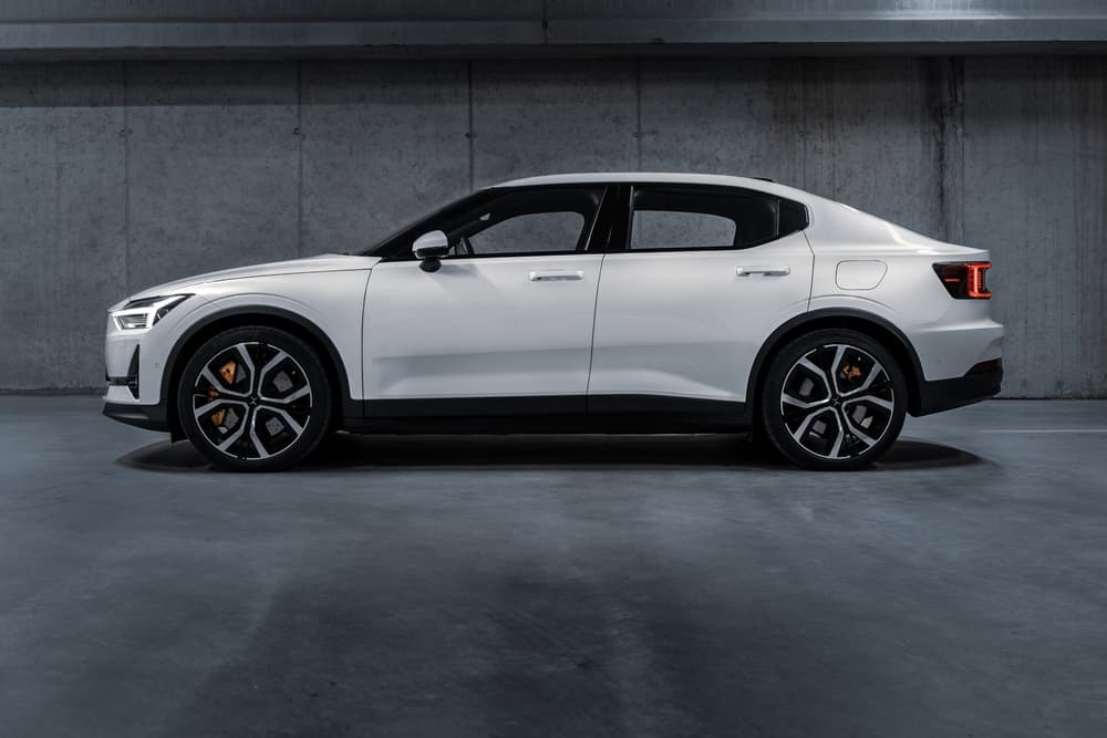 a white Polestar 2 in an underground parking lot