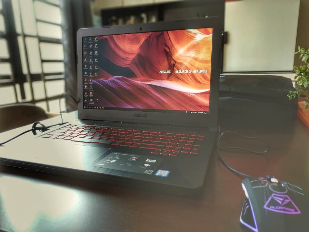 Black Asus Tuf Fx504 gaming laptop on a table