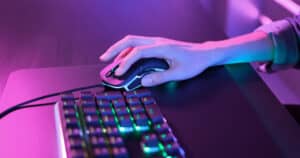 Hand using computer mouse gaming