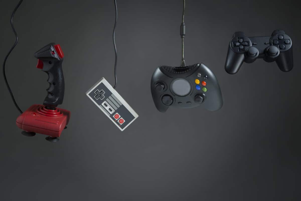 Video game console controllers hanging history retro