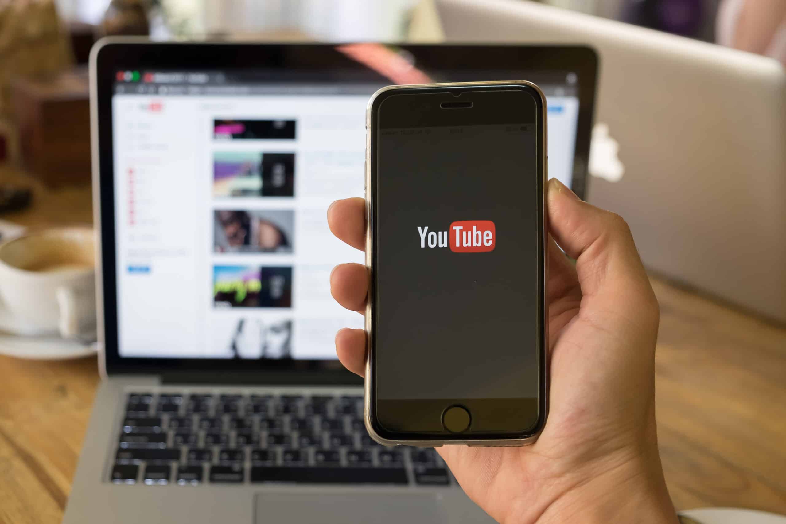 YouTube on smartphone and laptop