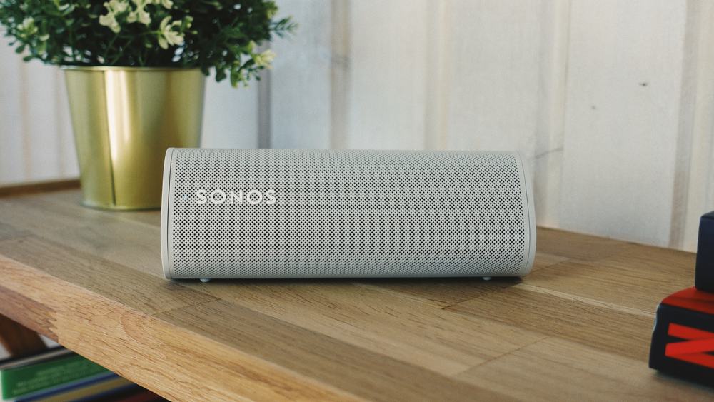 white sonos bluetooth speaker on a table