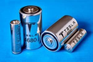 tesla 4680 cylindrical batteries on a blue background