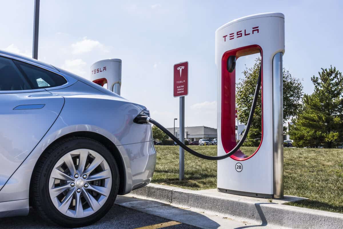 Tesla charging at a supercharger station