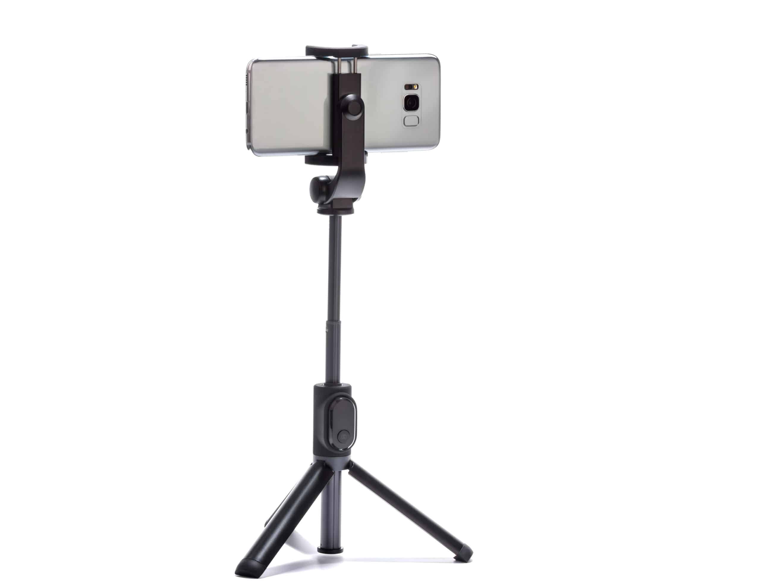 smart phone and tripod on white background