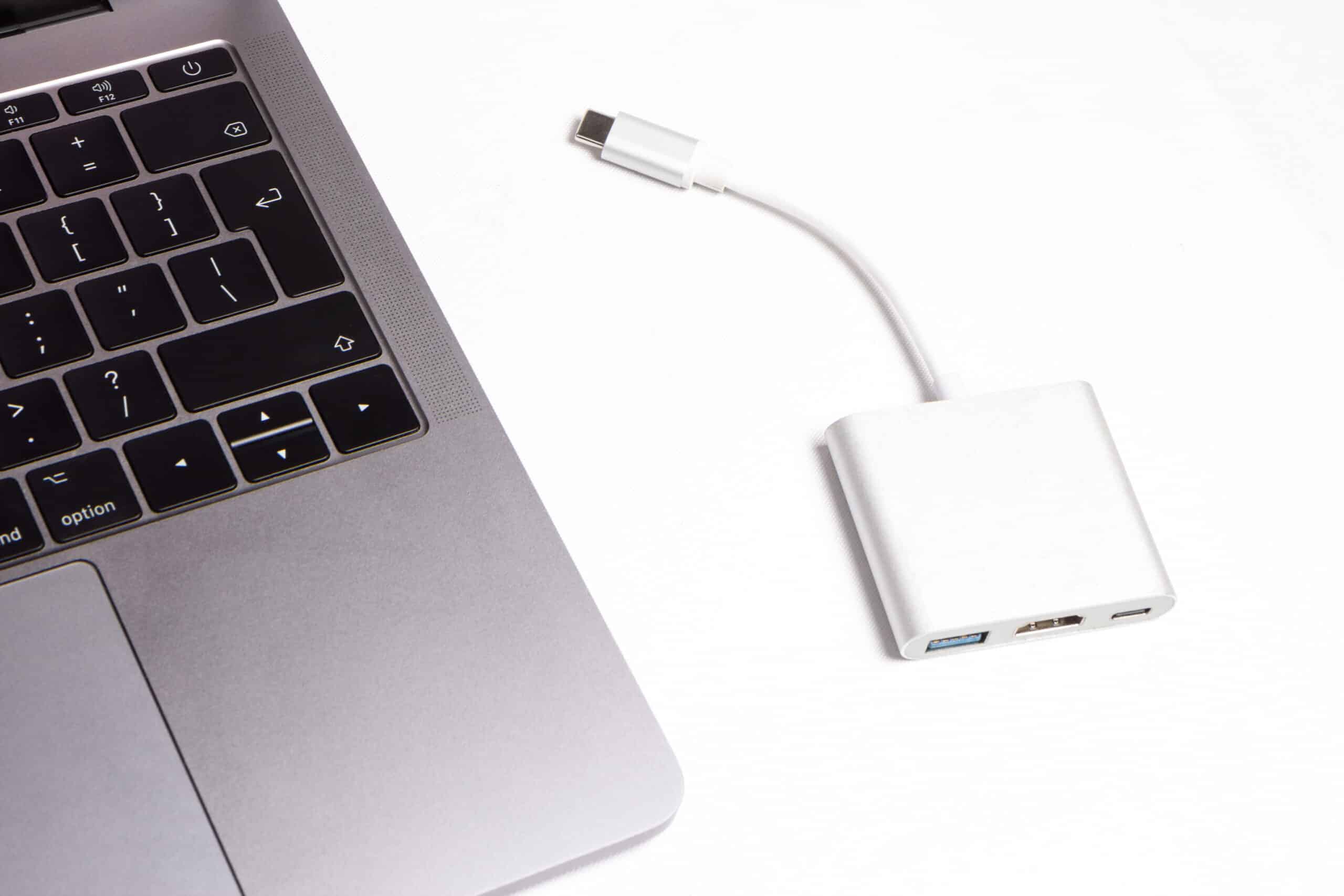USB-C adapter next to a laptop