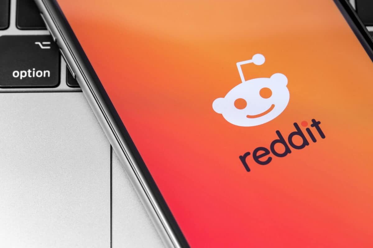 Reddit logo on iPhone screen.
