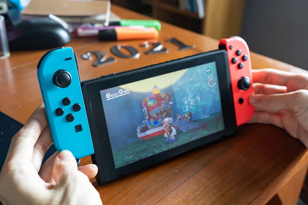 A man playing a game on Nintendo Switch console