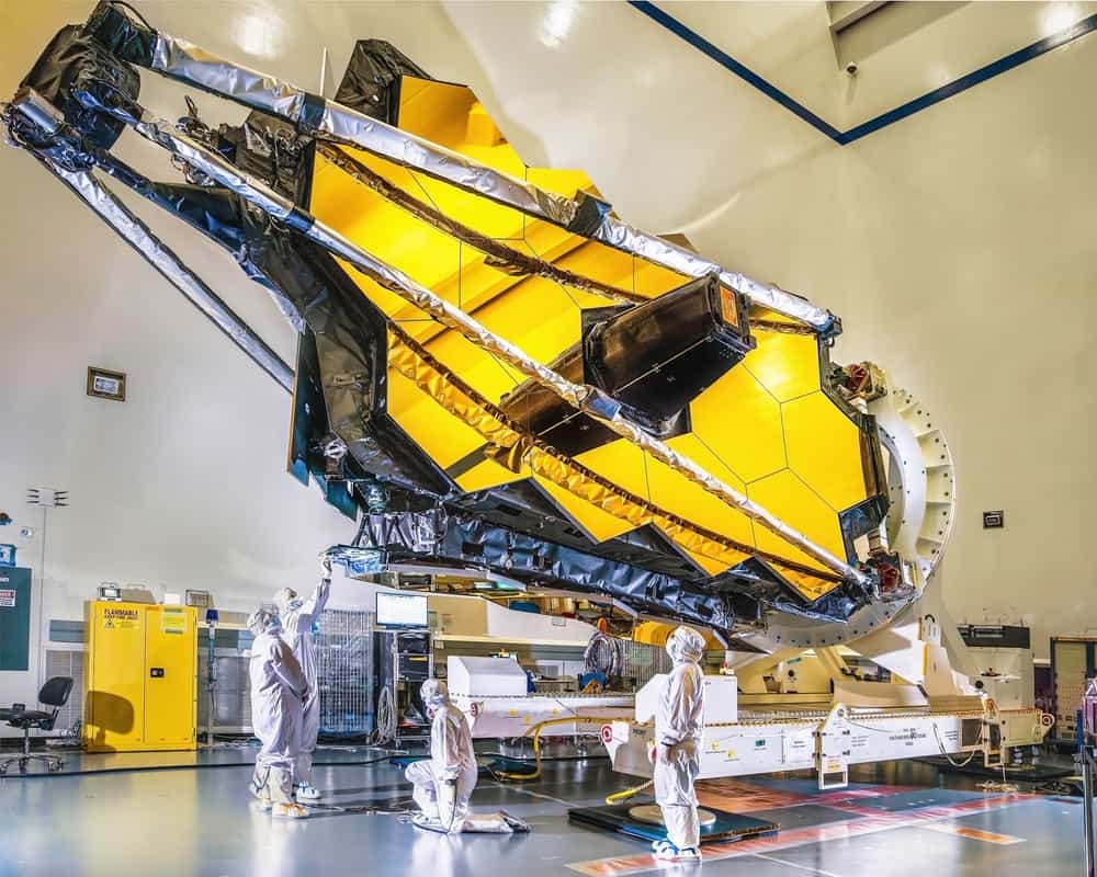 scientists and engineers assembling James Web Telescope