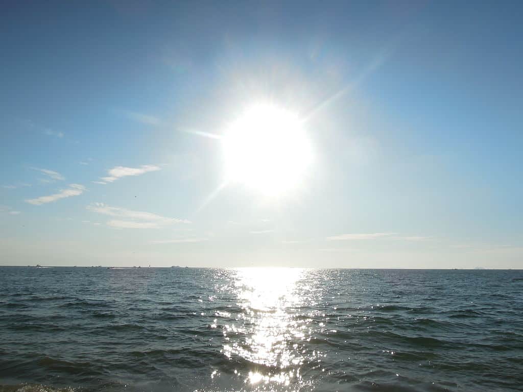 sun shining over the ocean