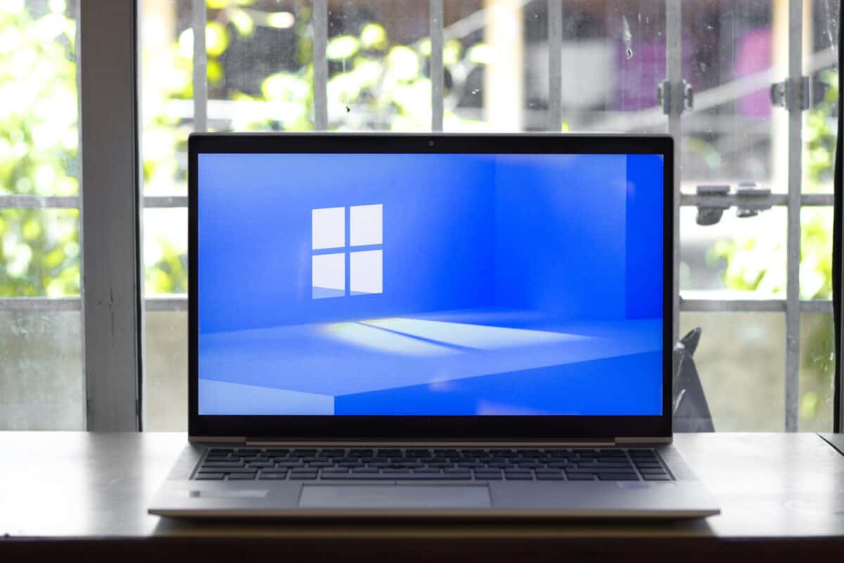 Laptop displaying Microsoft logo.