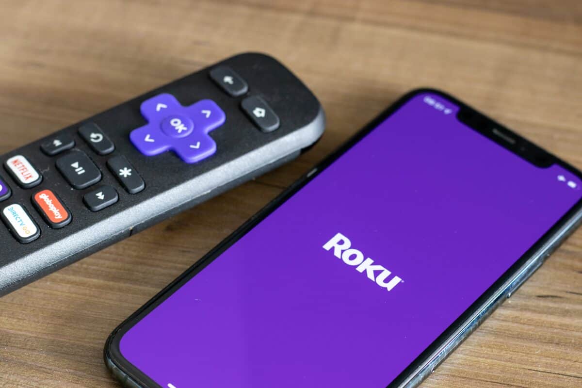 Roku remote next to Roku app.