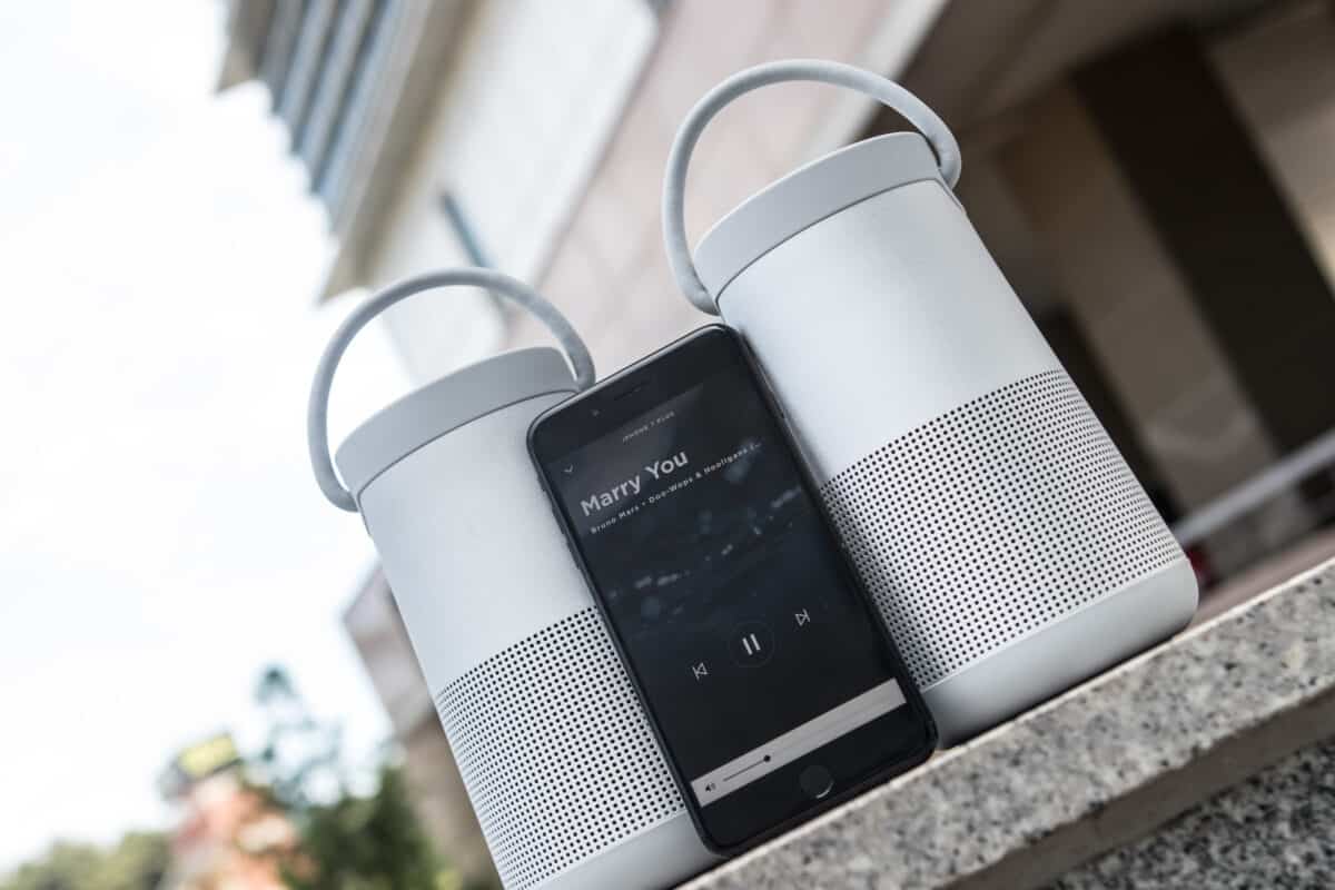 gray bose soundlink evolve speakers next to a smartphone