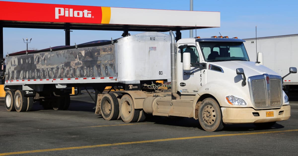 A Kenworth T680 trailer truck at a truck stop in Hesperia, CA.