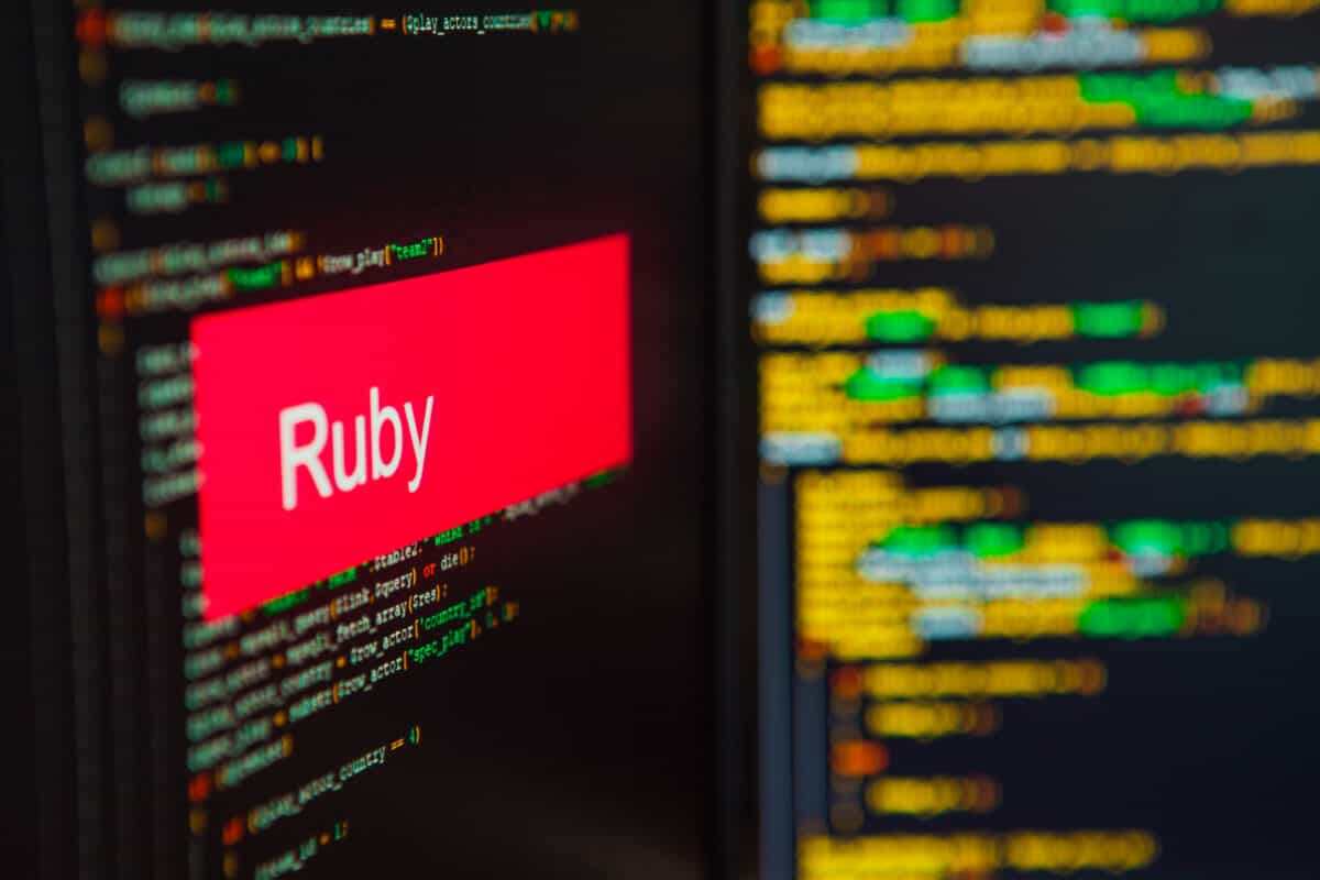 Ruby inscription on the background of computer code.