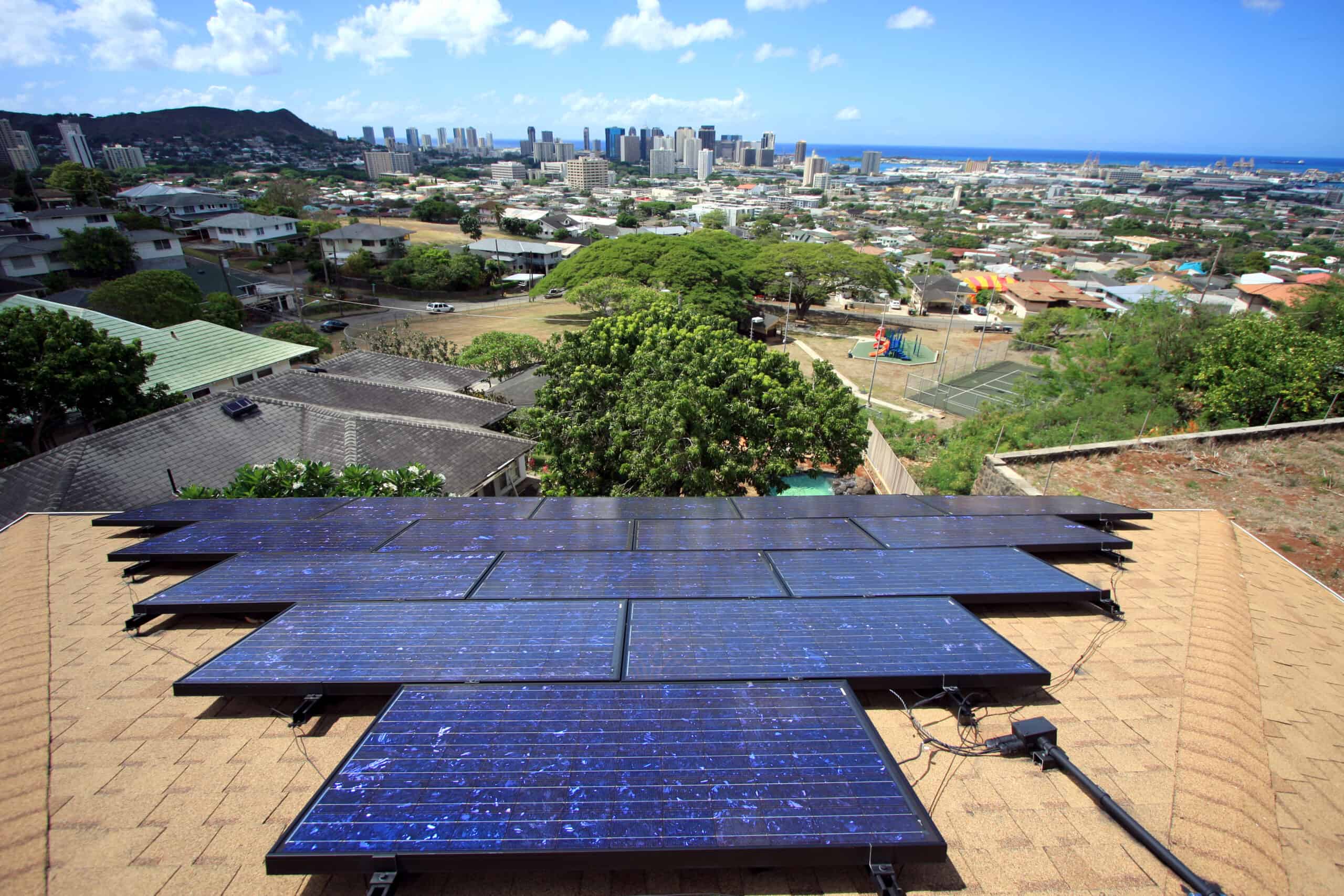 scenic view of downtown honolulu from a roof with solar panels