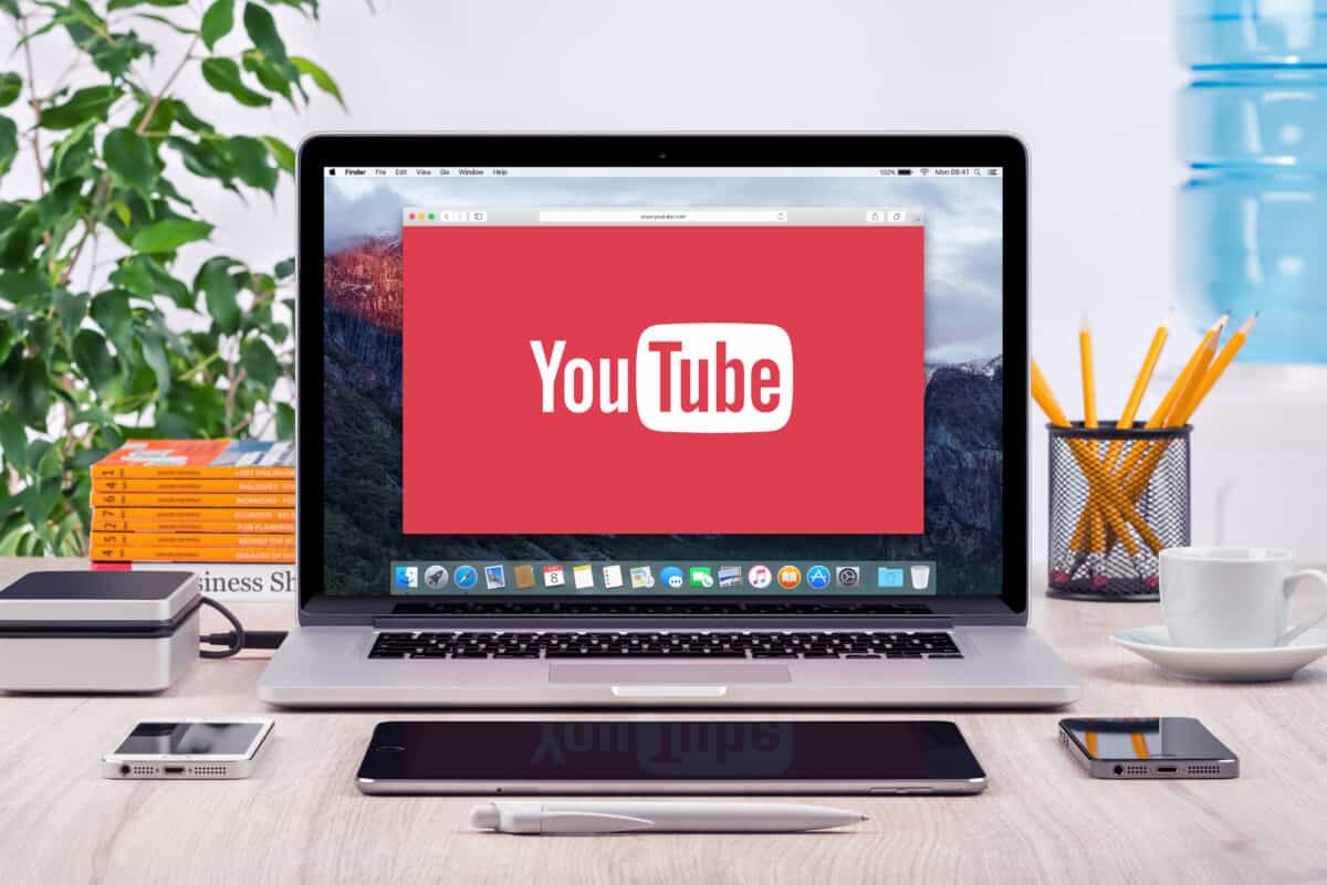 YouTube logo displayed on a MacBook