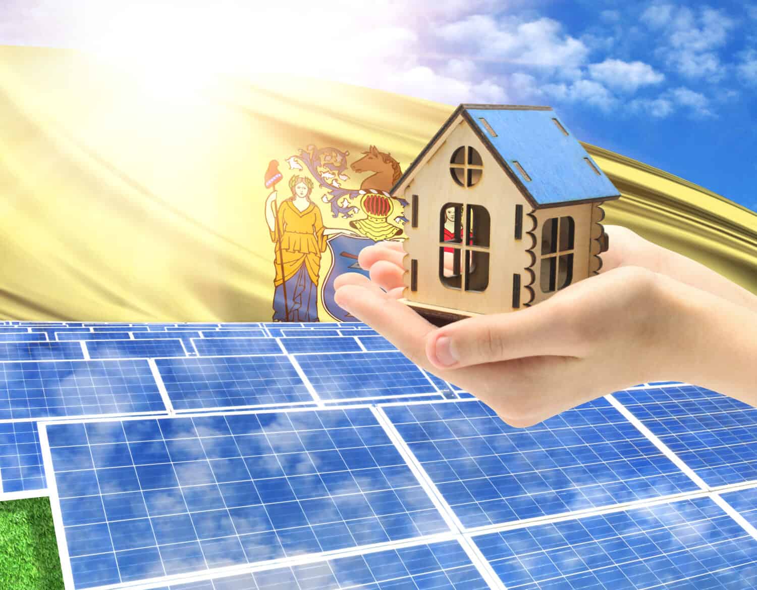 The photo with solar panels and a woman's palm holding a toy house shows the flag State of New Jersey in the sun.