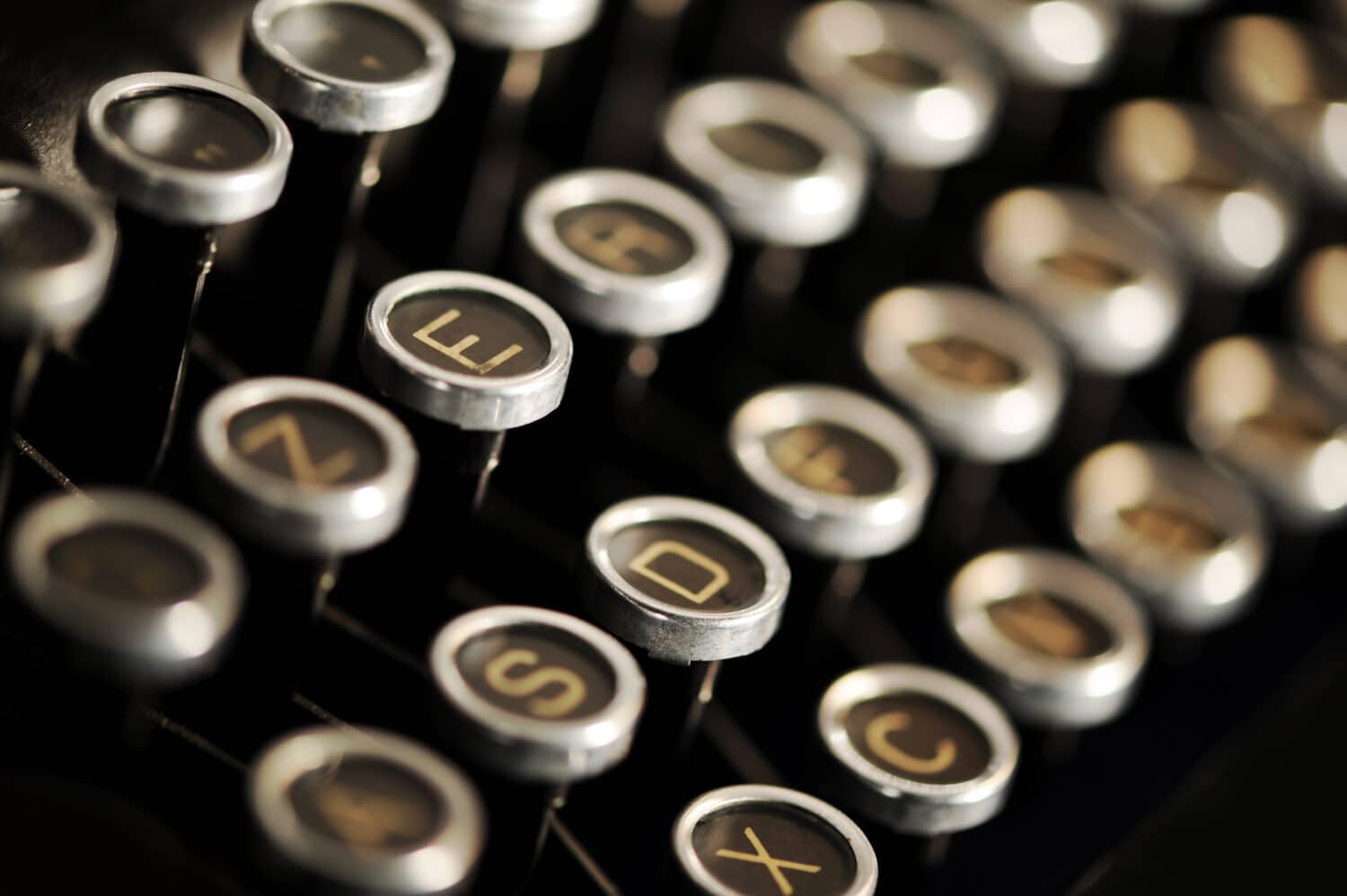 Close up photo of antique typewriter keys, shallow focus