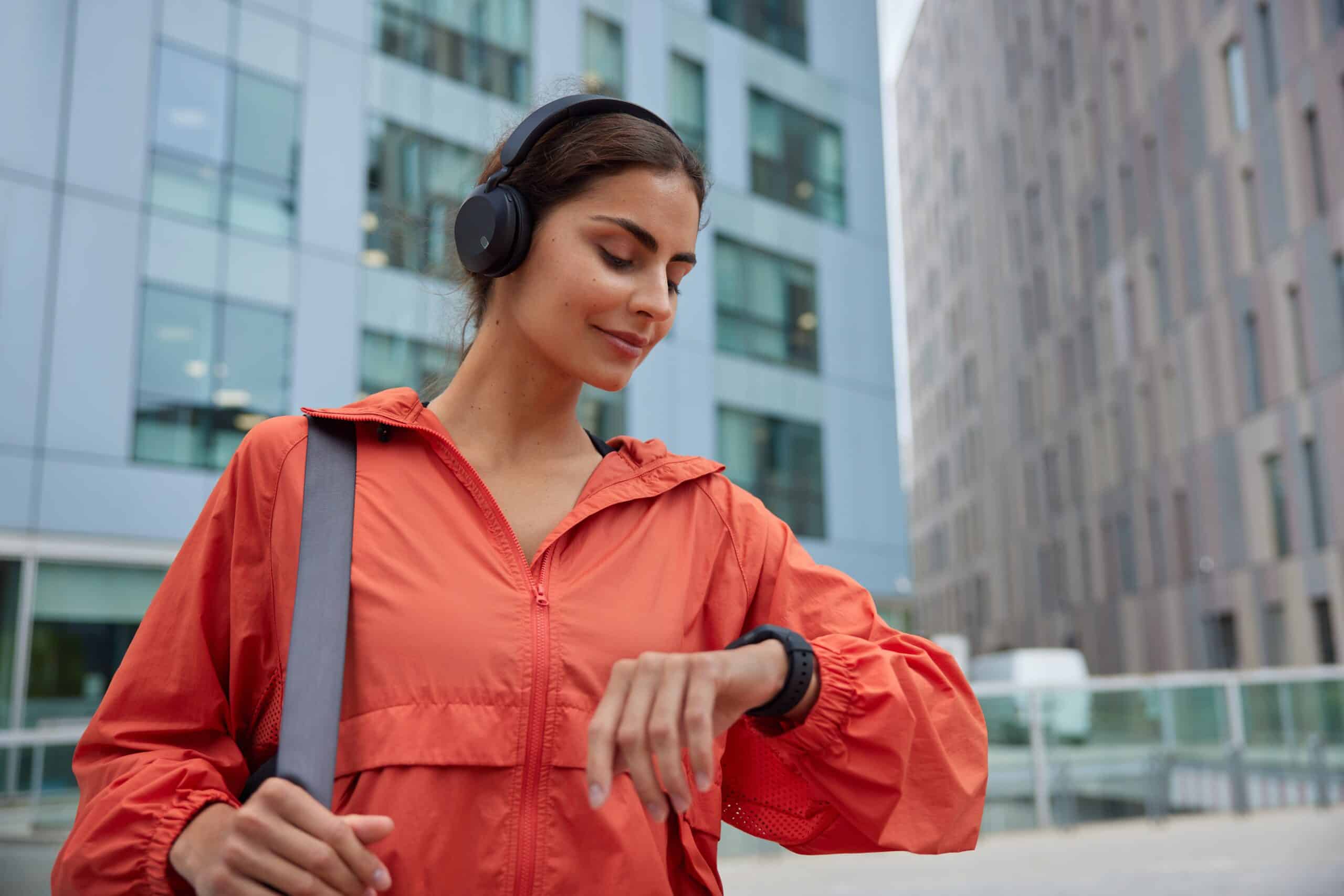 woman looking at smartwatch fitness tracker device