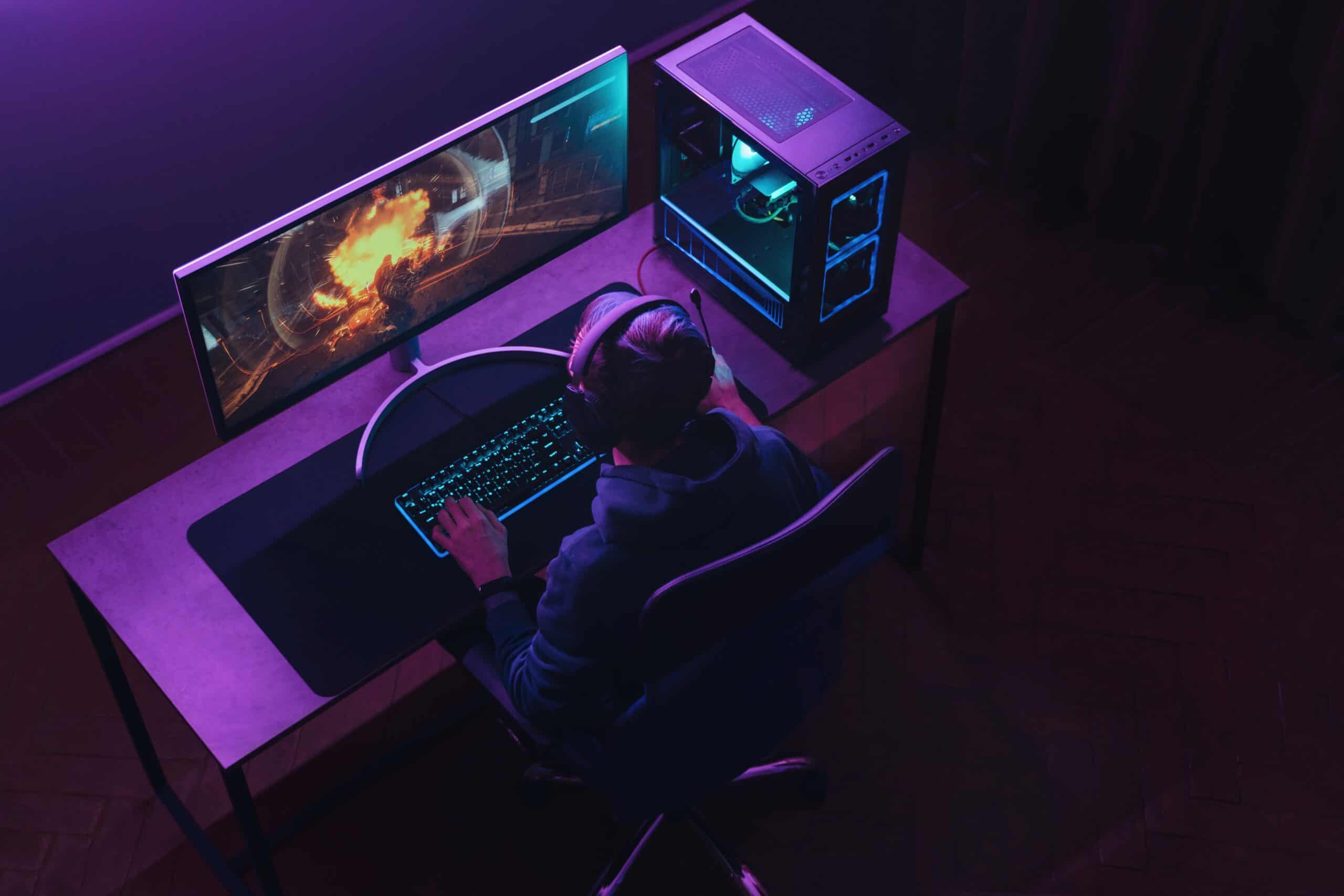 gamer on computer monitor setup video games