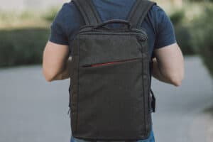 man wearing a laptop backpack