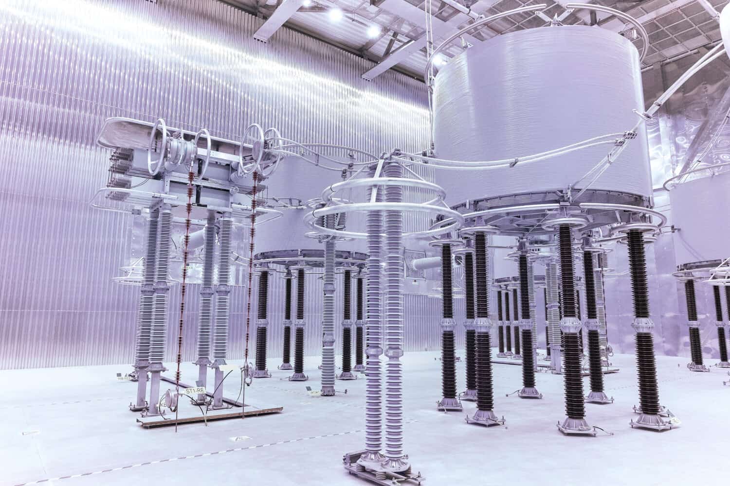 Inside high voltage direct current HVDC station. Electrical equipment in the closed substation looks futuristic.