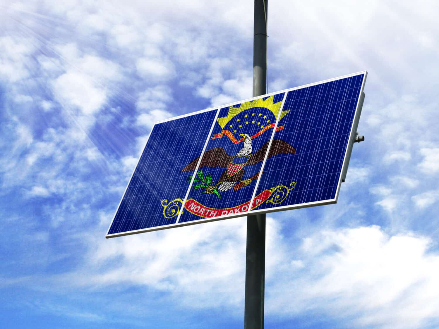 Solar panels against a blue sky with a picture of the flag State of North Dakota