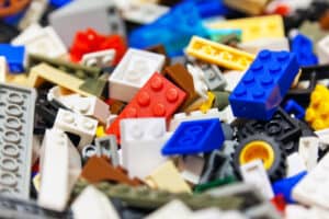 Macro view of heap of color plastic toy bricks. Selective focus effect