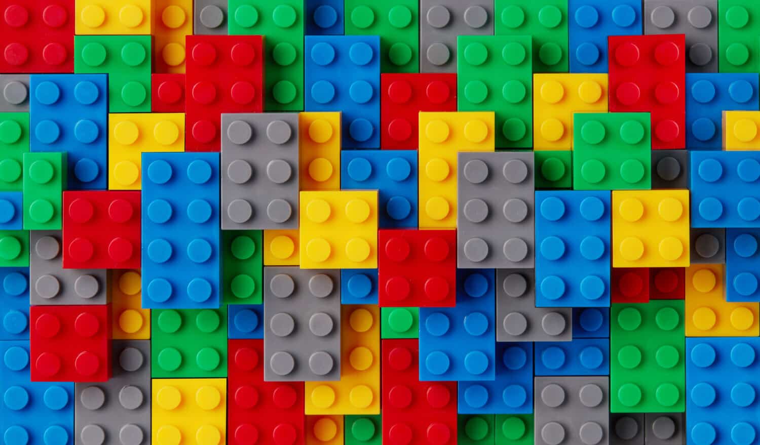 Multi-colored plastic blocks background closeup