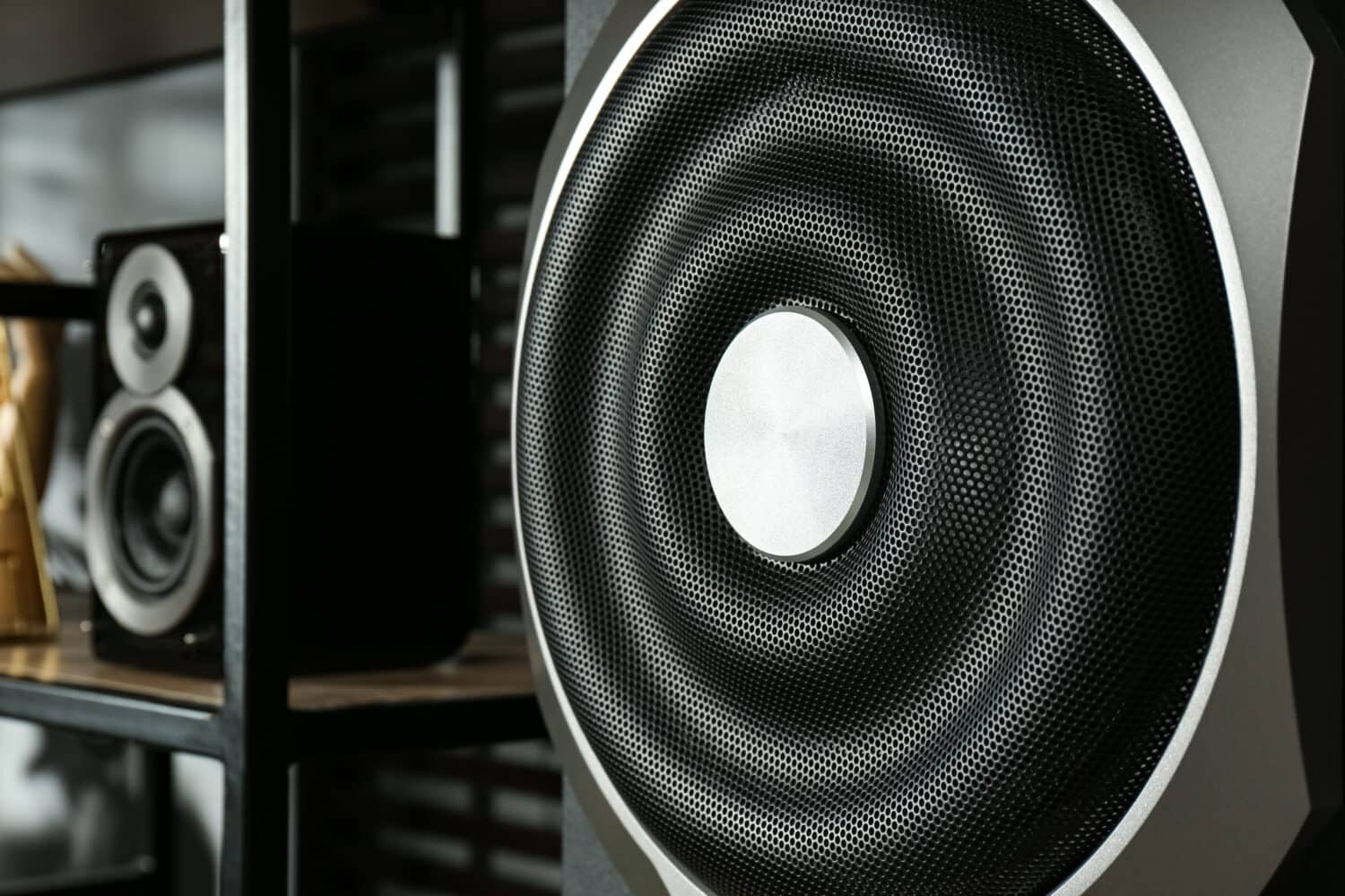 Modern powerful subwoofer indoors, closeup. Audio speaker system