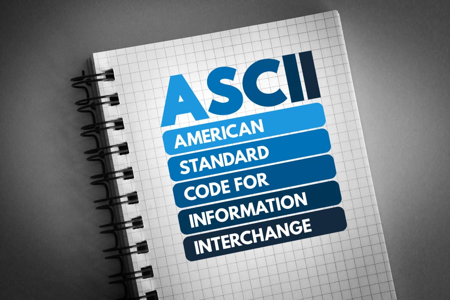 ASCII - American Standard Code for Information Interchange acronym on notepad, technology concept background