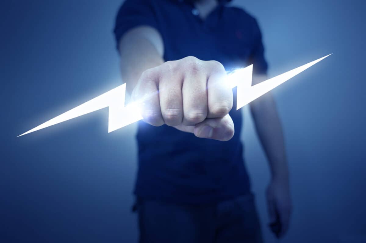 A man holding a stylized electric bolt.