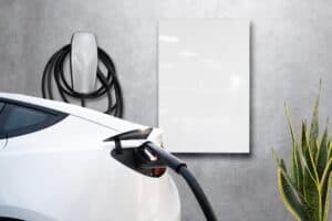 Home garage charging electric vehicle with Tesla cable