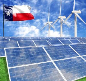 Solar panels on the background of a flagpole with the flag State of Texas and Wind Turbine