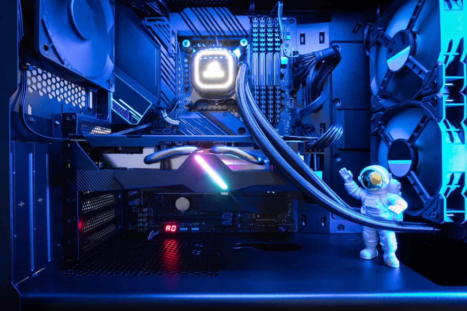 Close-up view of a custom-built gaming PC with liquid CPU Cooler and RGB lighting. Premium gaming setup. Gaming computer. Desktop PC.