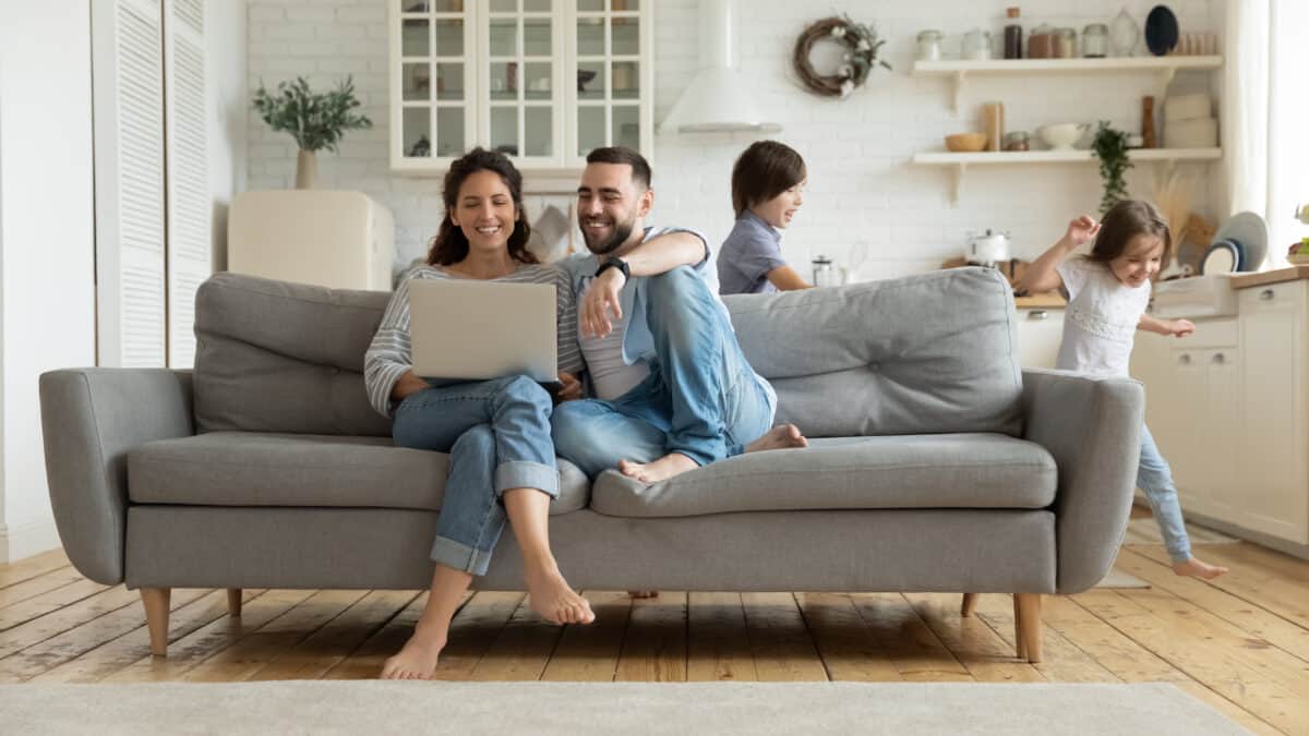 renters insurance couple on couch with kids at home