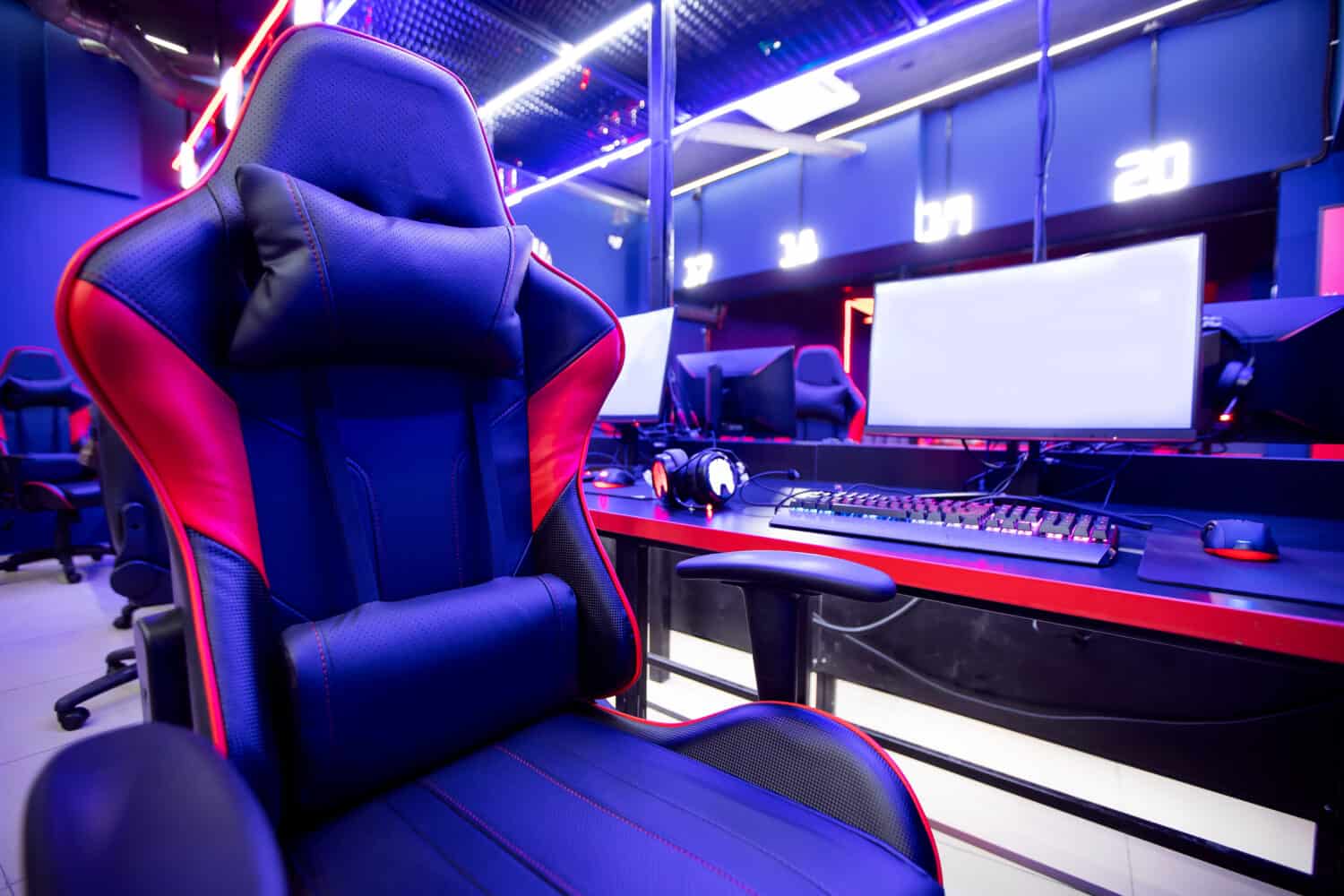 Professional gamers cafe room with powerful personal computer game chair blue color. Concept cyber sport arena.