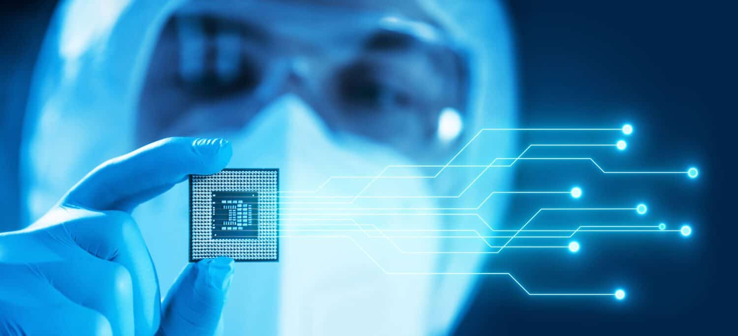 Close-up of Professional Scientist Holding a Modern Microprocessor Chip in Hand. Scientific Laboratory, Research and Development of Microelectronics and Processors. Computer Technology and Equipment.